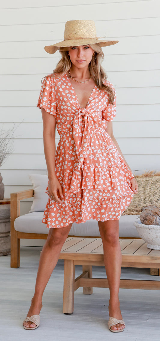 flowy mini dress with flutter sleeves, tie front and layered skirt featuring delicate sweet daisy pattern